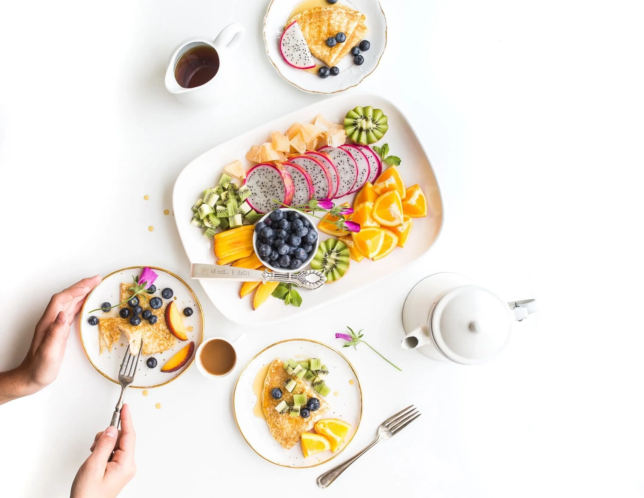 Breakfast with fruit platter and pancakes.